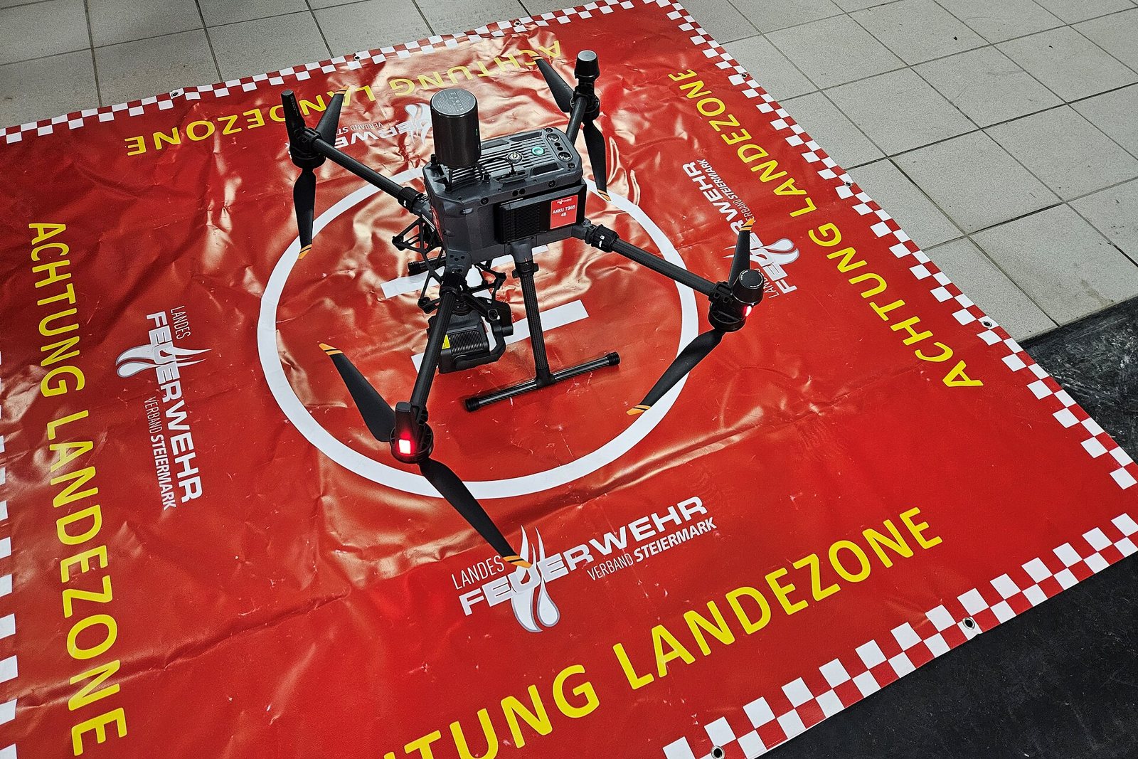 DJI Matrice 300 RTK fire-brigade drone on a fire-service landing zone
