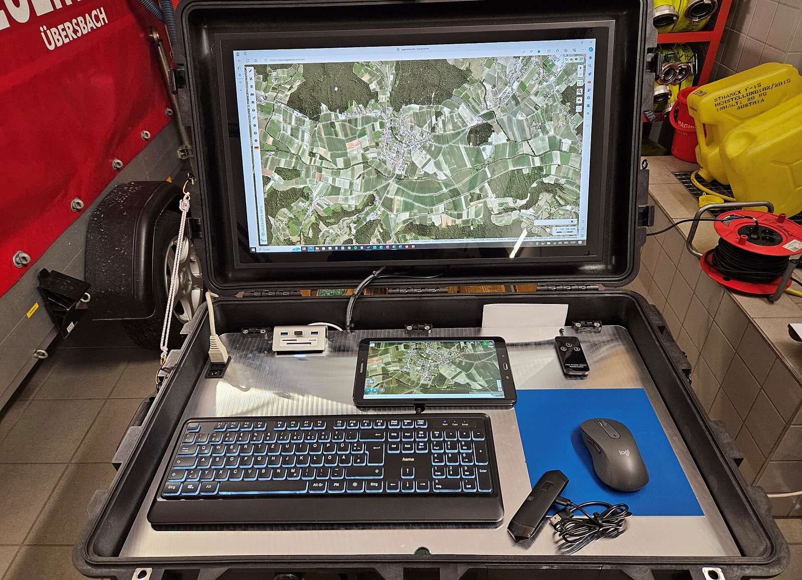 Drone ground station with a laptop showing an aerial map